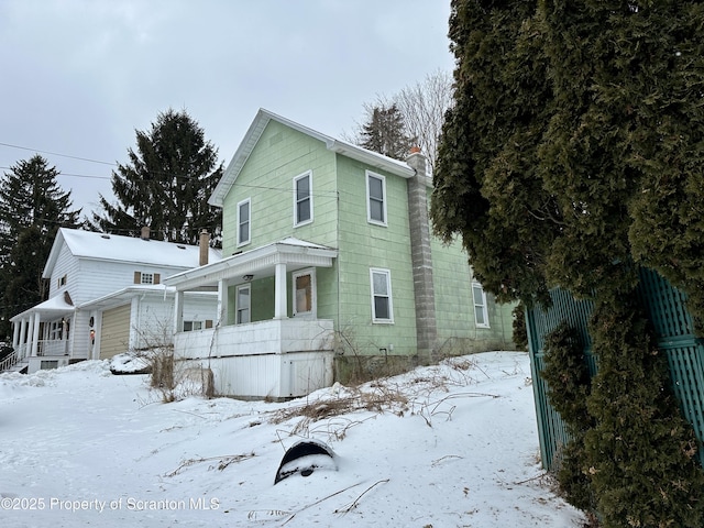 view of front of home with a garage and a porch