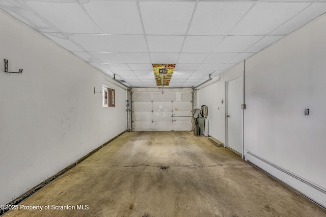 garage with a baseboard heating unit