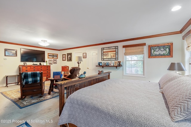 bedroom featuring crown molding and carpet