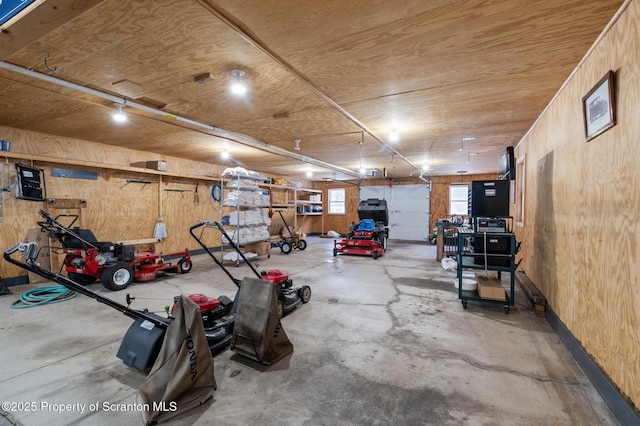 garage featuring wooden walls