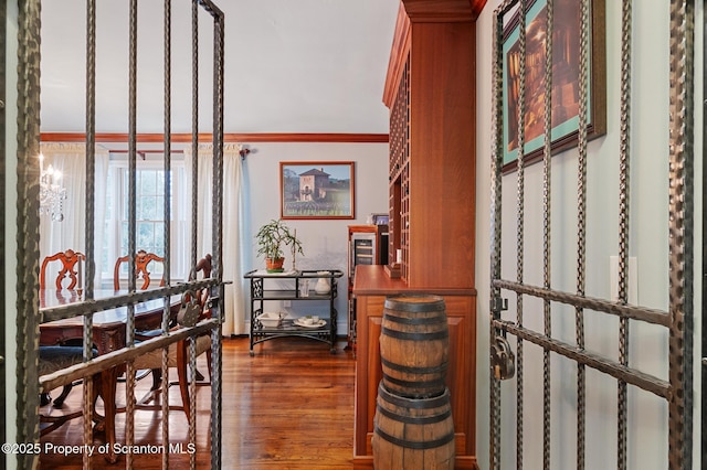 interior space featuring crown molding and wood-type flooring