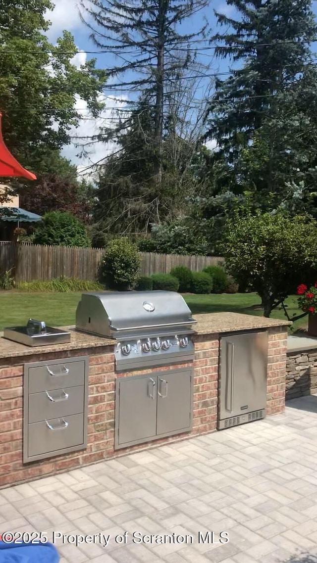 view of patio with area for grilling and grilling area