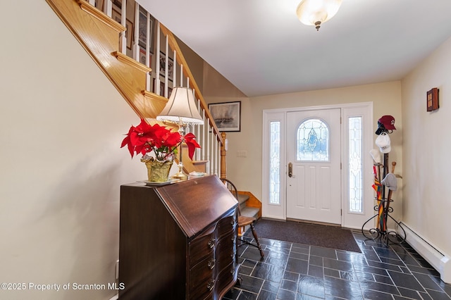 foyer featuring a baseboard heating unit