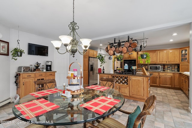 dining space with a notable chandelier