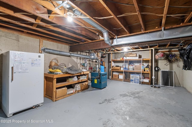 basement with white refrigerator