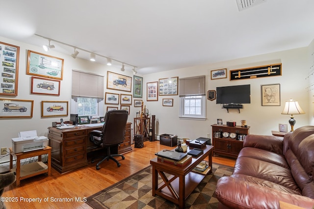 office area with light hardwood / wood-style flooring