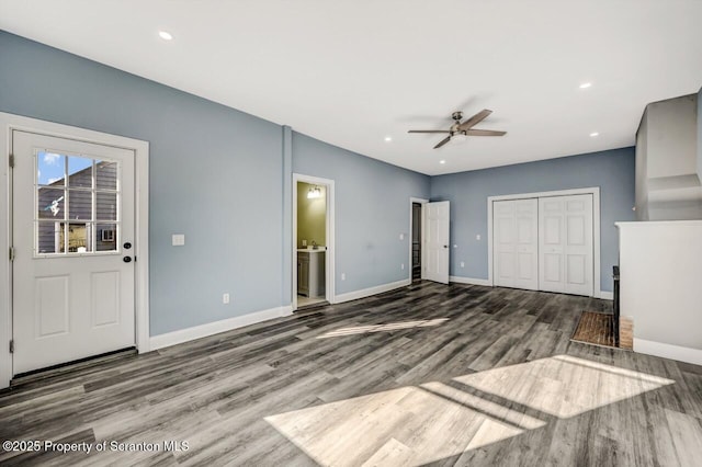 unfurnished living room featuring recessed lighting, wood finished floors, a ceiling fan, and baseboards