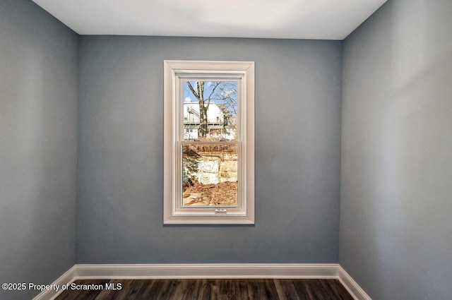 room details with baseboards and wood finished floors