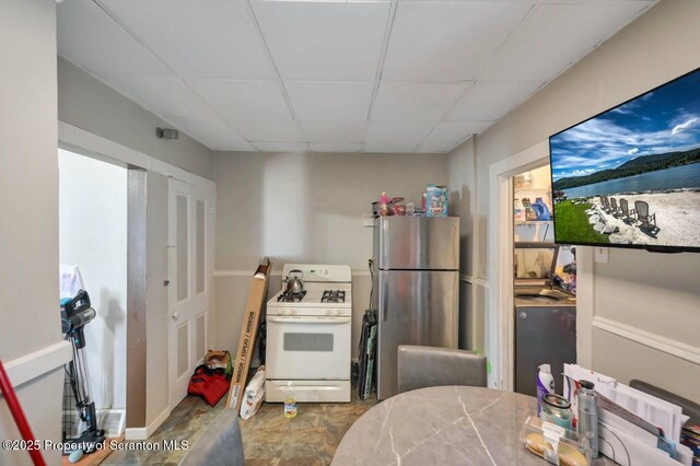 7 Oakwood Pl, Scranton, PA 18510 - kitchen featuring white gas stove, freestanding refrigerator, and a paneled ceiling
