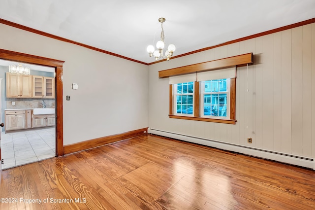 100 Short St, Edwardsville, PA 18704 - spare room with baseboard heating, crown molding, sink, a notable chandelier, and light hardwood / wood-style floors