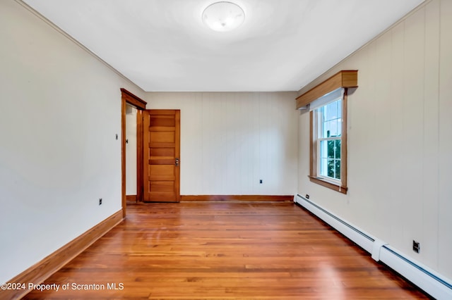100 Short St, Edwardsville, PA 18704 - unfurnished room featuring hardwood / wood-style flooring and a baseboard radiator