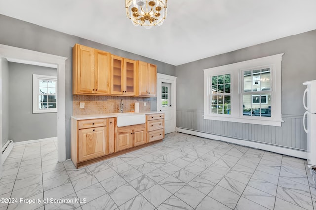 100 Short St, Edwardsville, PA 18704 - kitchen with decorative backsplash, a baseboard heating unit, sink, light brown cabinets, and a notable chandelier