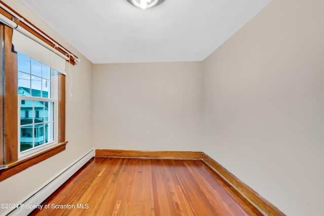 100 Short St, Edwardsville, PA 18704 - unfurnished room with hardwood / wood-style flooring and a baseboard heating unit