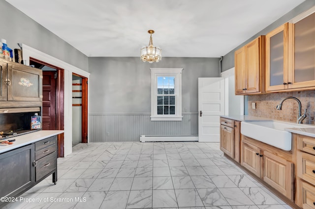 100 Short St, Edwardsville, PA 18704 - kitchen with pendant lighting, backsplash, sink, a baseboard radiator, and a chandelier