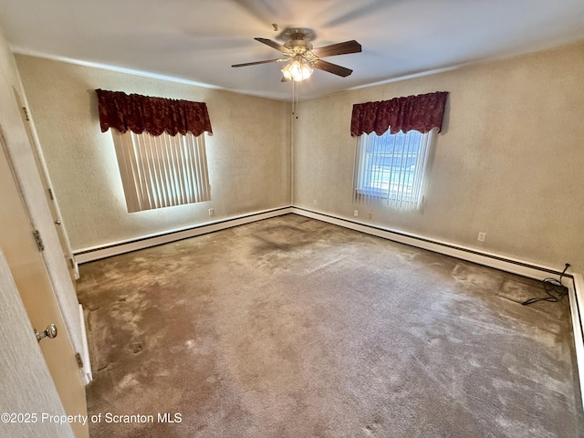 carpeted empty room with ceiling fan and baseboard heating