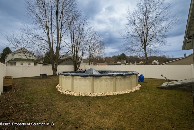 view of yard with a fenced in pool and a fenced backyard