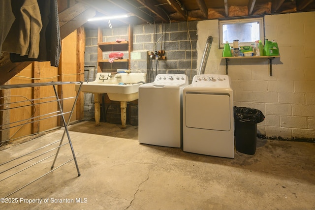 laundry area featuring laundry area, independent washer and dryer, and a sink