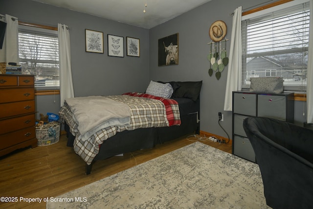 bedroom with wood finished floors