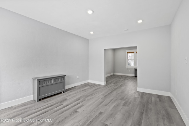 unfurnished room featuring light wood-type flooring