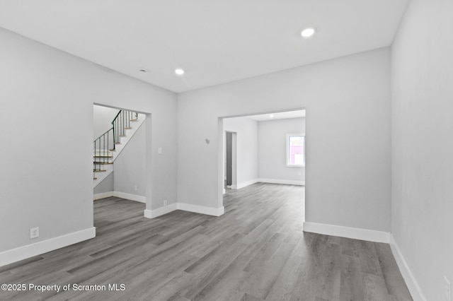 spare room with wood-type flooring