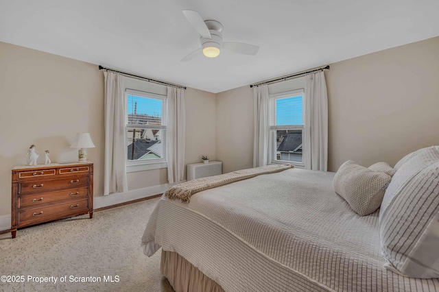 168 Cemetery St, Archbald, PA 18403 - bedroom featuring baseboards, multiple windows, ceiling fan, and light carpet