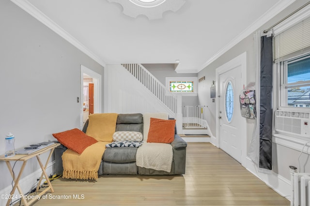 foyer entrance featuring hardwood / wood-style floors, cooling unit, and ornamental molding