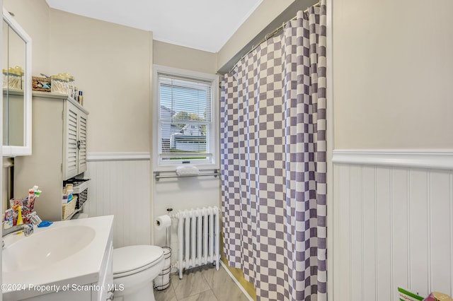 bathroom with radiator, vanity, tile patterned flooring, toilet, and curtained shower