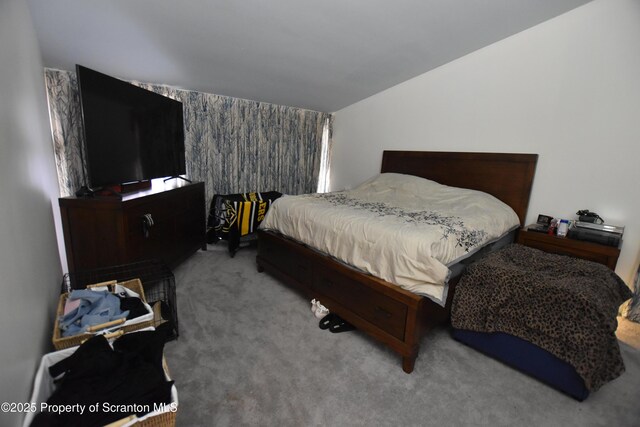 unfurnished room with lofted ceiling