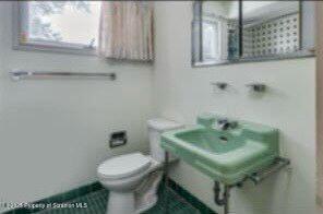 bathroom featuring toilet