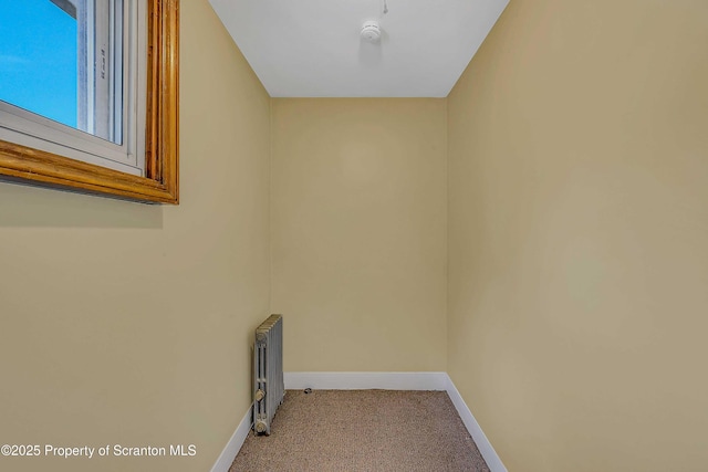 129-131 Main St, Dupont, PA 18641 - laundry room featuring radiator heating unit, carpet, and baseboards