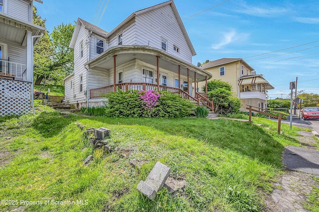 129-131 Main St, Dupont, PA 18641 - view of front of property with covered porch