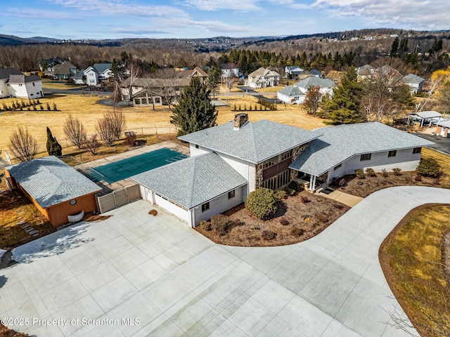 birds eye view of property with a residential view