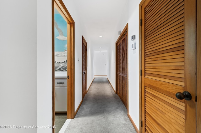 hall featuring recessed lighting and carpet floors