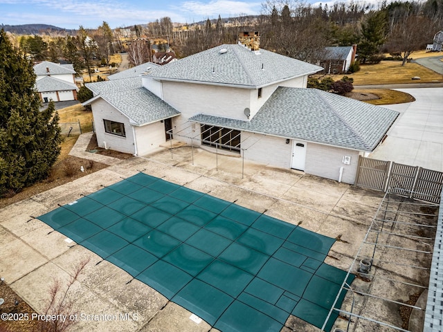 view of swimming pool with a patio, fence, and a fenced in pool