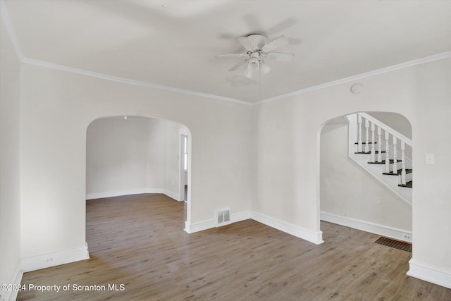 spare room featuring ceiling fan, hardwood / wood-style flooring, and ornamental molding