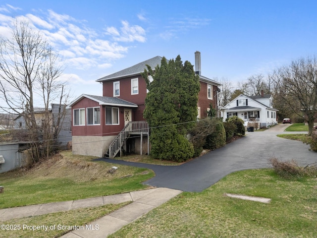 347 Orchard St, Old Forge, PA 18518 - view of front of home featuring a front yard, a shingled roof, stairs, and aphalt driveway