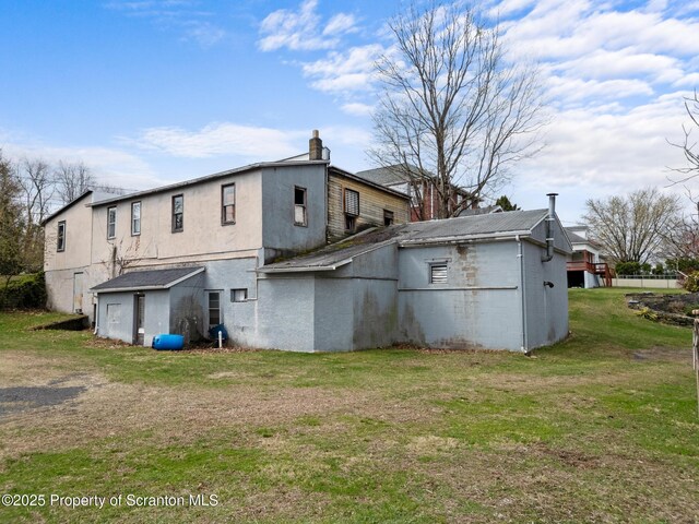 347 Orchard St, Old Forge, PA 18518 - rear view of house with a yard and a chimney