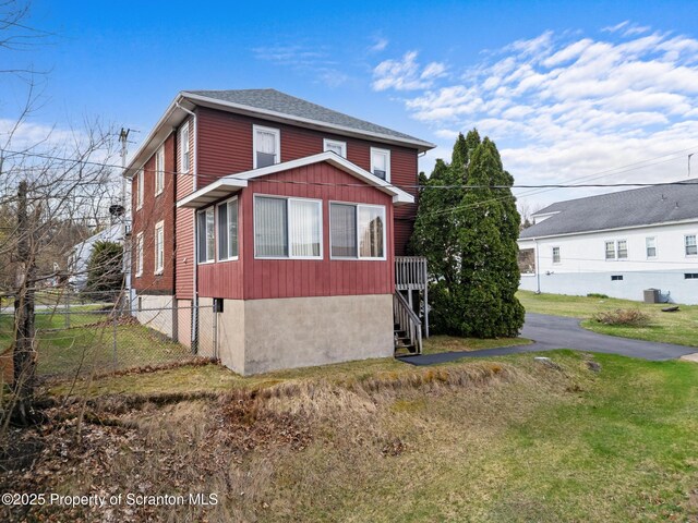 347 Orchard St, Old Forge, PA 18518 - view of side of property with a yard, fence, central AC, and roof with shingles