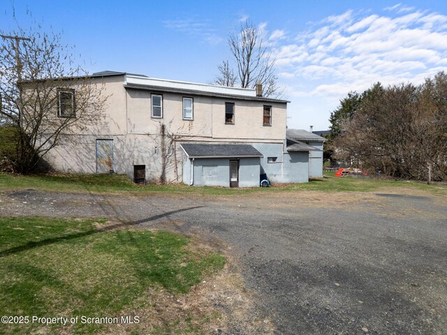 347 Orchard St, Old Forge, PA 18518 - back of property featuring driveway and stucco siding