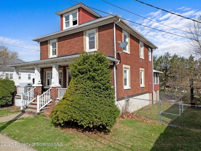 347 Orchard St, Old Forge, PA 18518 - view of front of home featuring a gate, a front lawn, a porch, brick siding, and fence