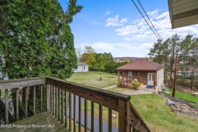 347 Orchard St, Old Forge, PA 18518 - deck with an outdoor structure and a lawn