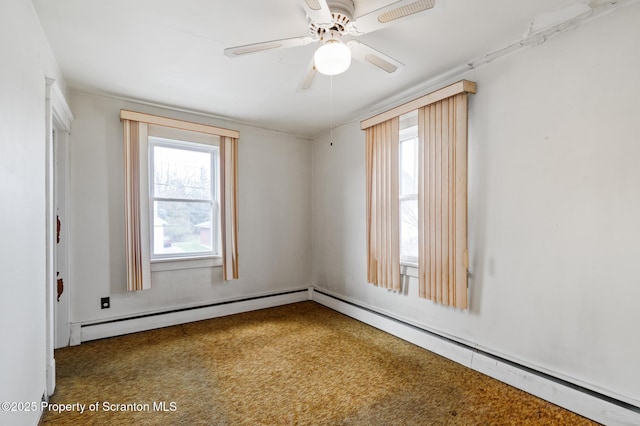 347 Orchard St, Old Forge, PA 18518 - empty room featuring carpet flooring, ceiling fan, a baseboard heating unit, and a healthy amount of sunlight
