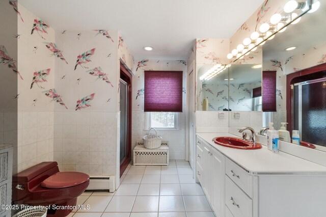 347 Orchard St, Old Forge, PA 18518 - bathroom featuring a baseboard heating unit, wainscoting, tile walls, tile patterned floors, and wallpapered walls