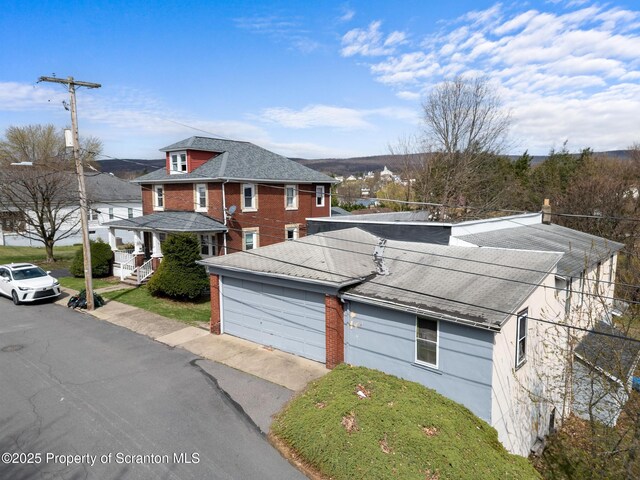 347 Orchard St, Old Forge, PA 18518 - view of front of home with brick siding and a shingled roof