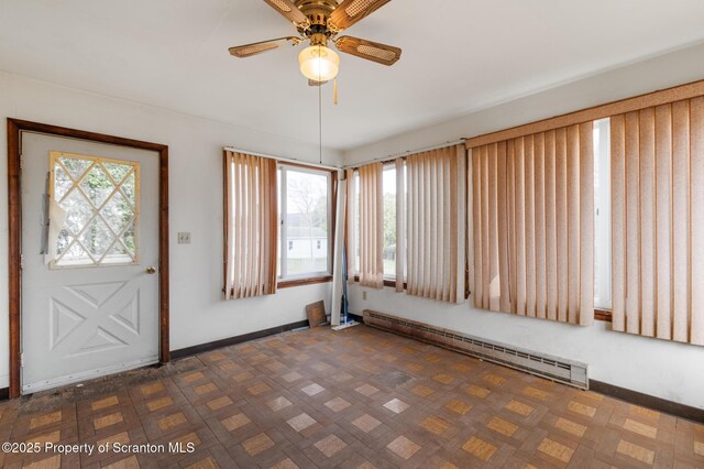 347 Orchard St, Old Forge, PA 18518 - entryway featuring a baseboard radiator, ceiling fan, plenty of natural light, and baseboards