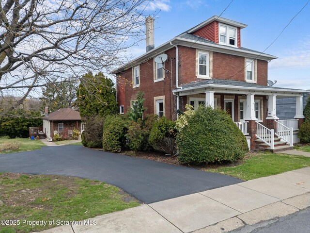 347 Orchard St, Old Forge, PA 18518 - traditional style home with a porch, a chimney, and brick siding