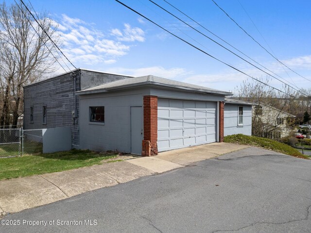 347 Orchard St, Old Forge, PA 18518 - detached garage featuring fence and a gate