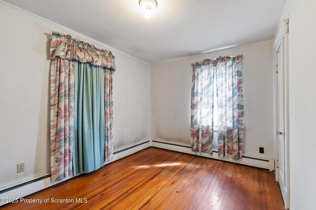 347 Orchard St, Old Forge, PA 18518 - interior space featuring a baseboard radiator, baseboard heating, and hardwood / wood-style flooring