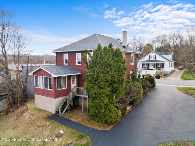 347 Orchard St, Old Forge, PA 18518 - view of front of home with aphalt driveway, a chimney, and a shingled roof