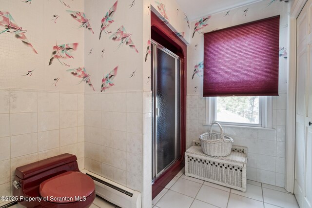 347 Orchard St, Old Forge, PA 18518 - full bath featuring tile walls, baseboard heating, radiator heating unit, tile patterned flooring, and a stall shower